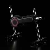 FRAME 01 thrusting sex machine — black aluminum body on splayed stainless-steel legs with four suction-cup feet